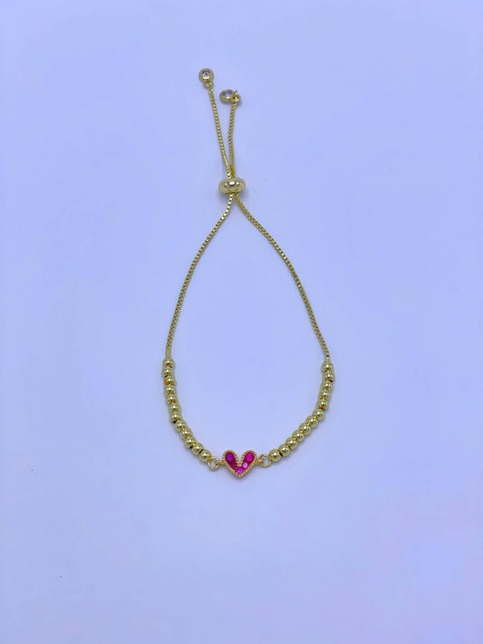 Pulsera graduable dije corazón fucsia