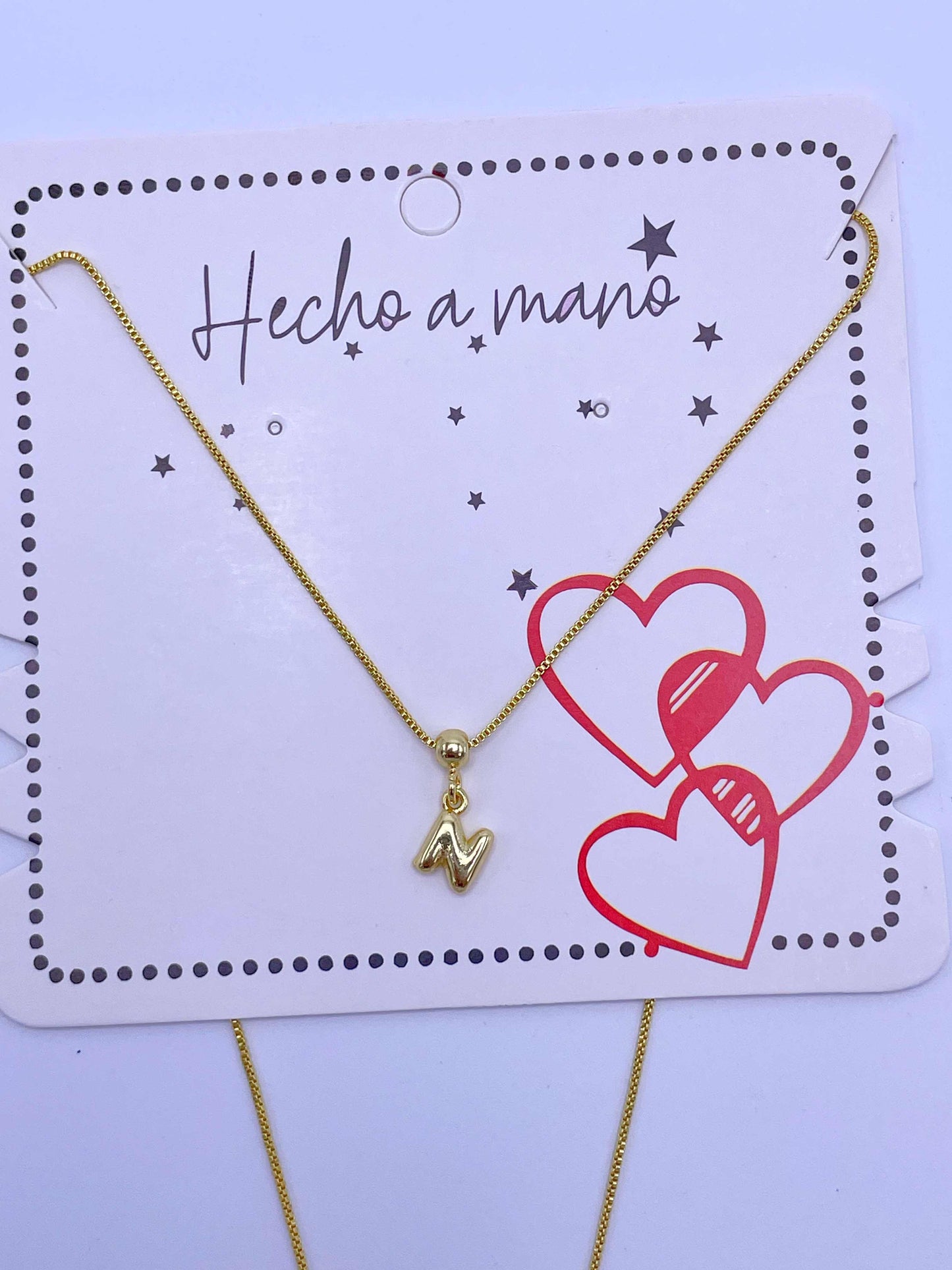Cadena aguja con inicial