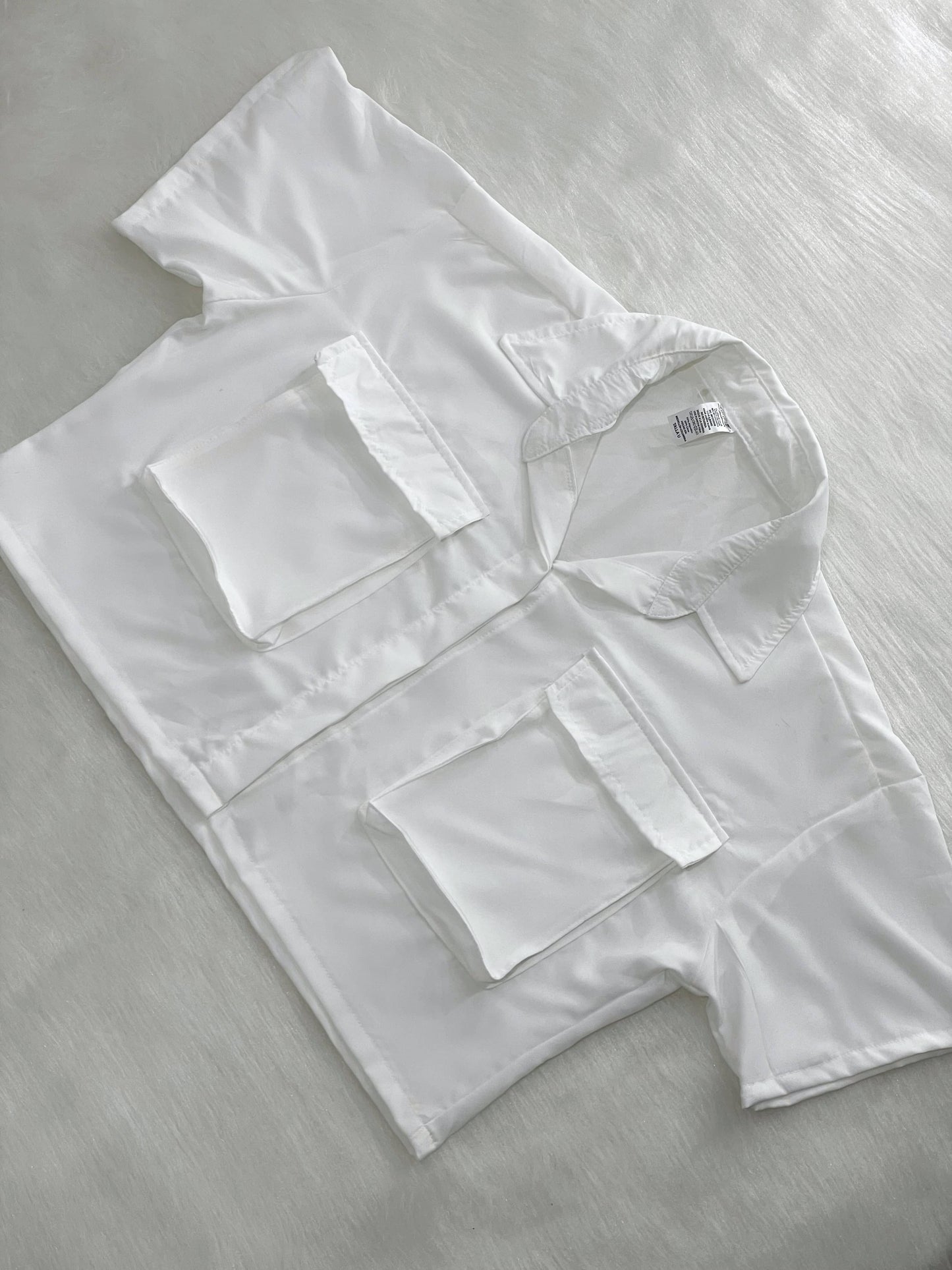 Camisa de bolsillos blanca