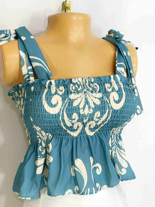 Blusa de boleros fondo turquesa